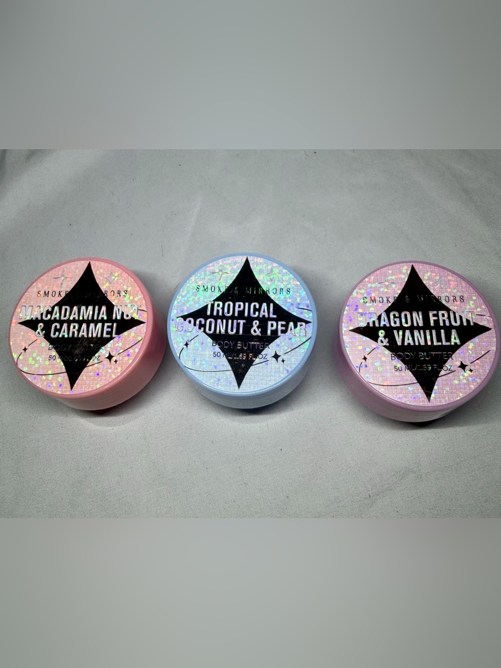 3 small tubes of different scented lotions